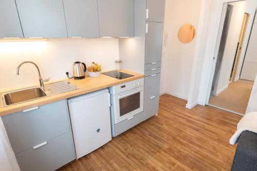 Kuchyňa alebo kuchynka v ubytovaní Appartement T2 neuf, cosy & tout confort - Proche Centre ville par Groom