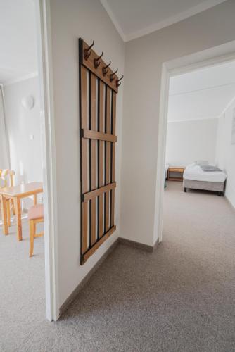 a room with a door leading to a bedroom at Hotel Felix in Kraków