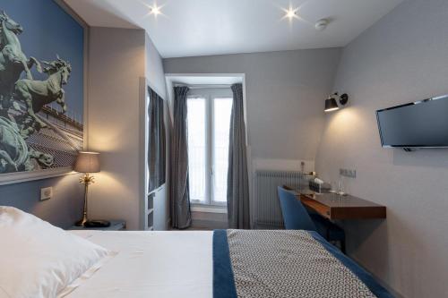 Ένα ή περισσότερα κρεβάτια σε δωμάτιο στο Hotel Saint Christophe