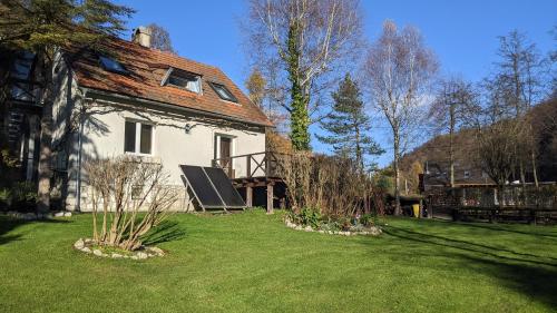 an old house with a roof on a yard at Agroturystyka SPA in Zelków