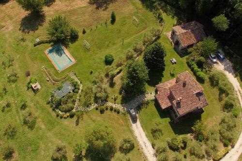 an aerial view of a large estate with a house at Villa I Camini - Outbuilding, dependance - Swimming pool - Garden - BBQ and fireplaces - Soccer field in Monte Castello di Vibio