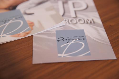 a close up of two envelopes on a table at Stadshotel Rijssen in Rijssen