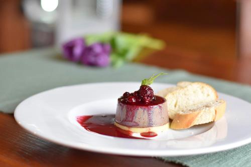 a white plate with a dessert on a table at Hotel Petřín in Jablonec nad Nisou