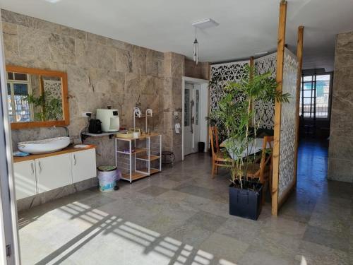 a living room with a stone wall at Diamond Luxury Apartment - Haifa in Haifa
