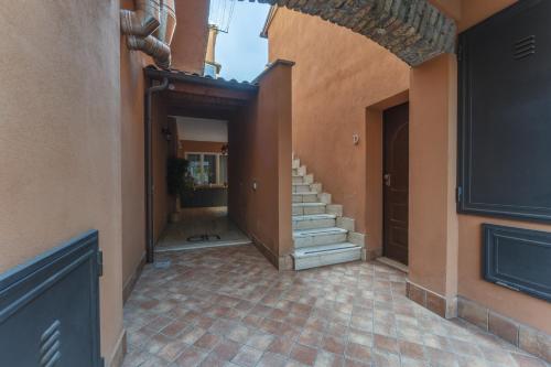 an empty hallway with stairs in a house at Dalmati House San Lorenzo in Rome