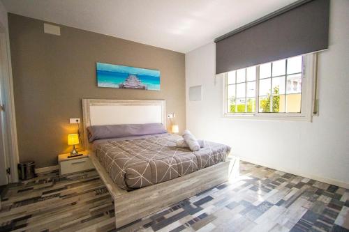 a bedroom with a bed and a window at Catalunya Casas Relax and Recharge - only 34km from Barcelona! in Rubí
