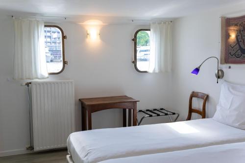 Ein Bett oder Betten in einem Zimmer der Unterkunft Hotel The Boatel