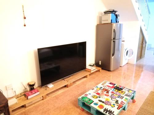 TV a/nebo společenská místnost v ubytování La Preneuse sur Mer Appartement
