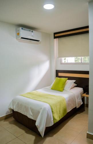 Ένα ή περισσότερα κρεβάτια σε δωμάτιο στο Hotel MC Suites - Confort cerca del Aeropuerto