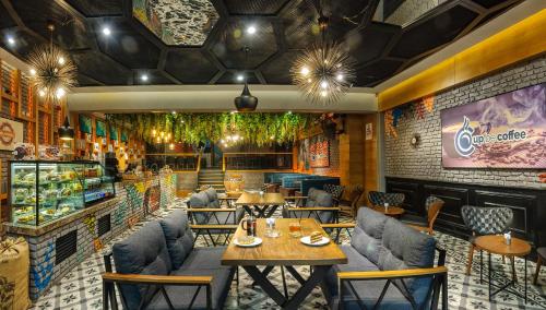 a restaurant with tables and chairs in a room at Hotel Bossuite Kadikoy in Istanbul