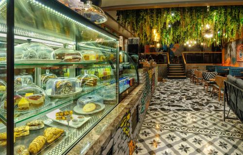 a bakery with a display case filled with food at Hotel Bossuite Kadikoy in Istanbul