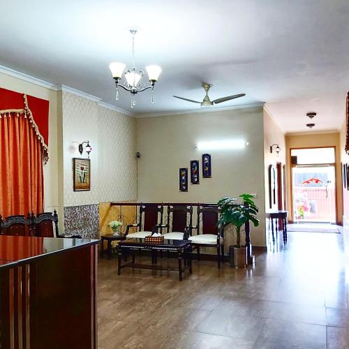 a living room with a couch and a table at New Pakeeza Hotel in Lahore