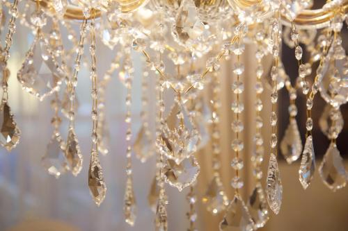 a bunch of crystals hanging from a chandelier at Haus bei der Linden Ferienwohnungen in Schwangau