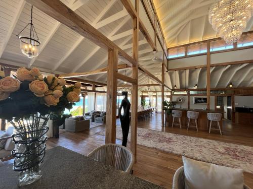 a man standing in the middle of a living room at Aloha 5 in Ponta Mamoli