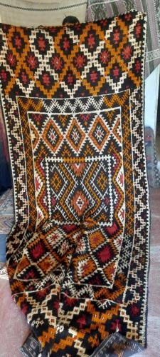 a colorful rug is sitting on a table at Maison d'Hôtes Irocha in Tisselday