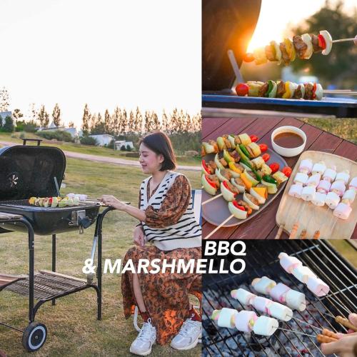 a woman is cooking food on a grill at SOL Glamping at Khao yai in Ban Nong Makha
