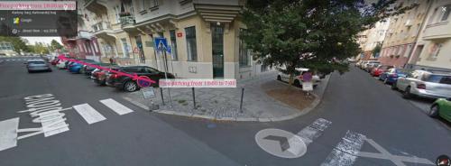 a view of a city street with cars parked at Holiday Apartments in Karlovy Vary