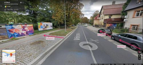 a rendering of a street with cars parked on it at Holiday Apartments in Karlovy Vary