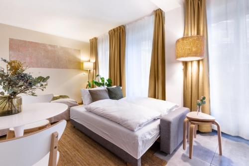 a hotel room with a bed and a table at TurnKey I Studio by Amazing Park in Prague