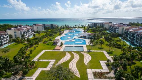 an aerial view of a resort with a swimming pool at Stunning Ocean Front By Condo Boutique in Playa del Carmen