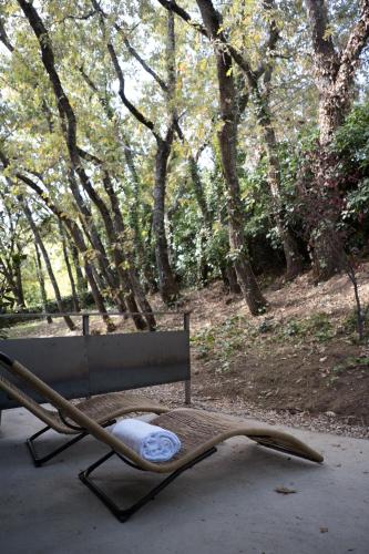 a chair with a towel on it next to a bench at BOX ART ALPINO in Navacerrada
