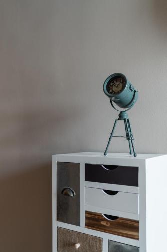 a camera sitting on top of a dresser at Ariane's Guesthouse in Sesto