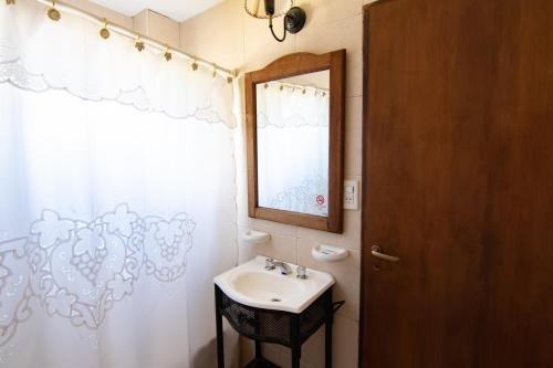 a bathroom with a sink and a mirror at Glaciares De La Patagonia in El Calafate