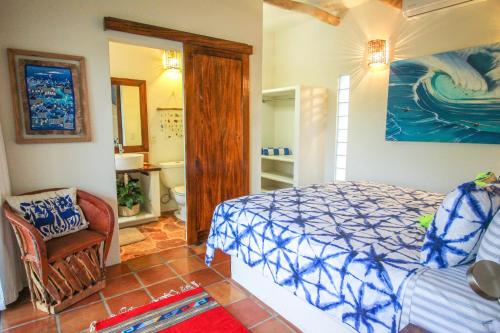 Ένα ή περισσότερα κρεβάτια σε δωμάτιο στο Vida Feliz Casitas