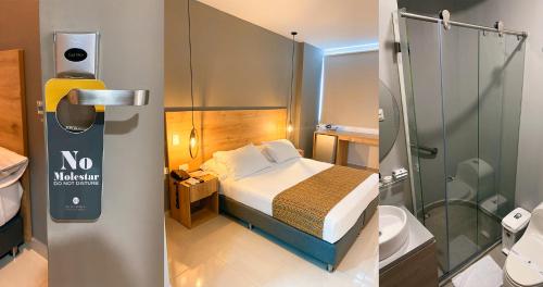 baño pequeño con cama y ducha en Hotel Ruittoque D Prada en Bucaramanga