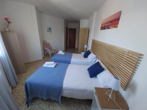 Postel nebo postele na pokoji v ubytování ALBAIDA