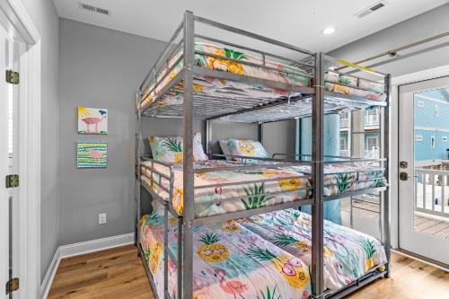 a bunk bed room with two bunk beds at Heaven's Outpost in Holden Beach