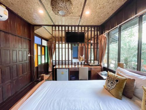 Giường trong phòng chung tại U Maerim Chiangmai - อยู่แม่ริม เชียงใหม่