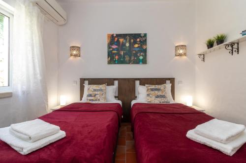 Ένα ή περισσότερα κρεβάτια σε δωμάτιο στο Casa Cinquenta e Um