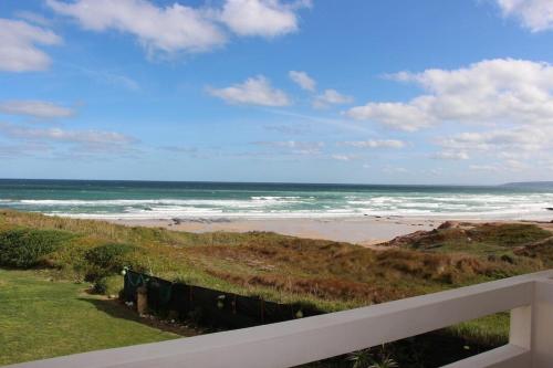 a view of the ocean from a balcony of a beach at Baleal, by the sea with swimming pool in Baleal