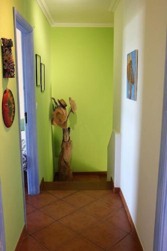 a room with a painting of a moose on the wall at Baleal, by the sea with swimming pool in Baleal