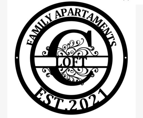 a black and white logo for the memphis apartment hotel at Apartament Loft in Elblag
