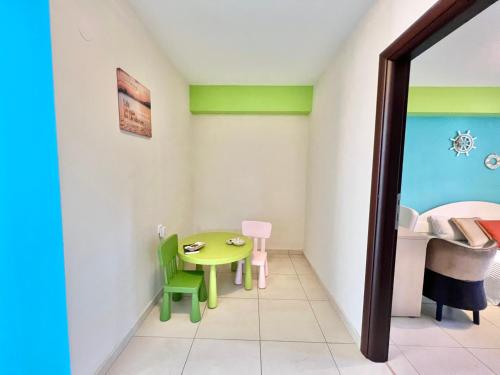 a small room with a table and a bed at Sermilie Beach Houses in Psakoudia