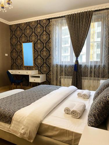 Postel nebo postele na pokoji v ubytování Shirbakyan Boutique Hotel & Apartments