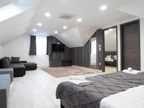 Postel nebo postele na pokoji v ubytování Andoravendégház - Villány