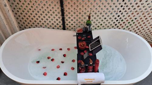 a white tub filled with water with red hearts at Levittown Lakes in Levittown