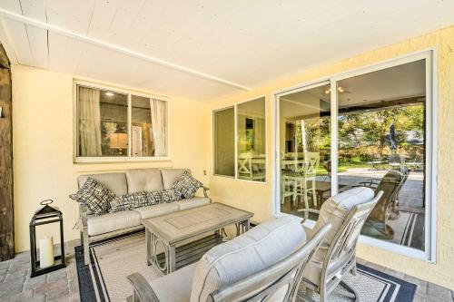 a living room with a couch and chairs and a table at Walk to Lake Stunning Central Florida Home! in Lake Mary