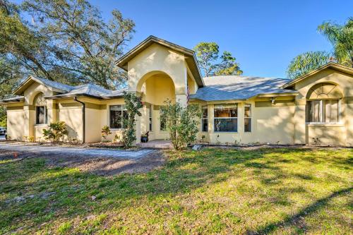 a house with a large yard in front of it at Walk to Lake Stunning Central Florida Home! in Lake Mary
