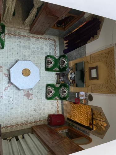 an overhead view of a kitchen with a table and a counter at House Naïma in Rabat