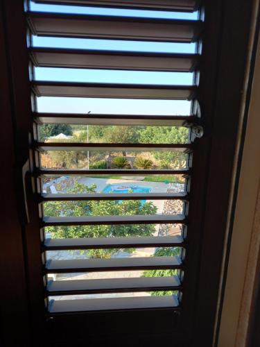 a view from a window with blinds at Scicli Città felice in Scicli