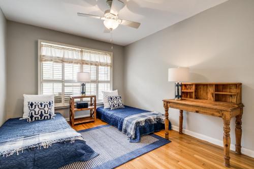 a room with two beds and a piano at Exclusive Historical Townhome: serene and cozy in San Antonio