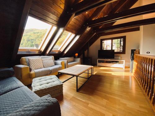 a living room with a couch and a table at Inmocyma Casa Estrac in Villanova