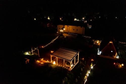 an overhead view of a city at night with lights at Vila Deniri in Zlatibor