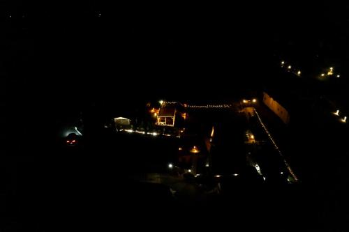 a night view of a street with cars and lights at Vila Deniri in Zlatibor