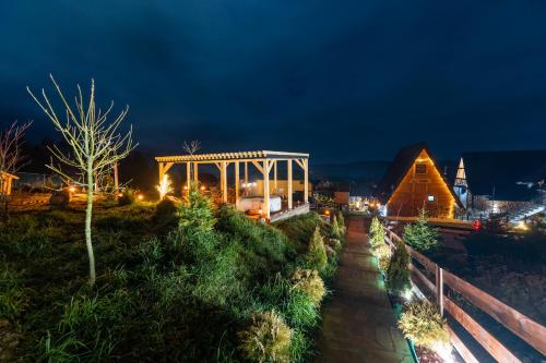 a view of a city at night at Vila Deniri in Zlatibor