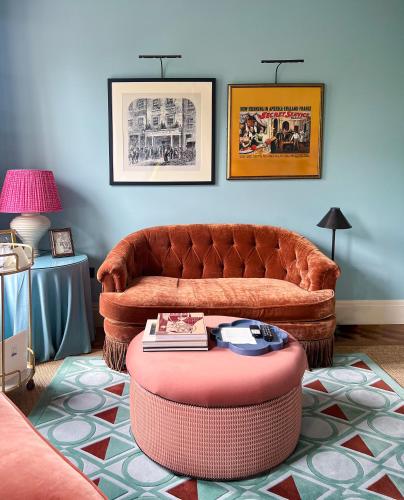 a living room with a couch and a coffee table at Beaverbrook Town House in London